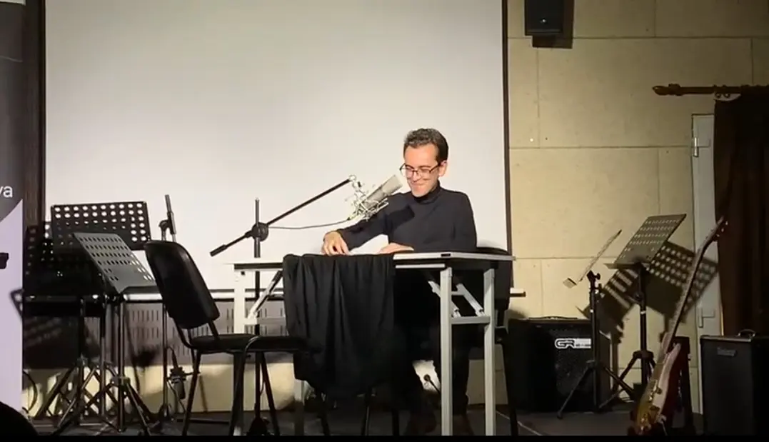 An artist performing sound art